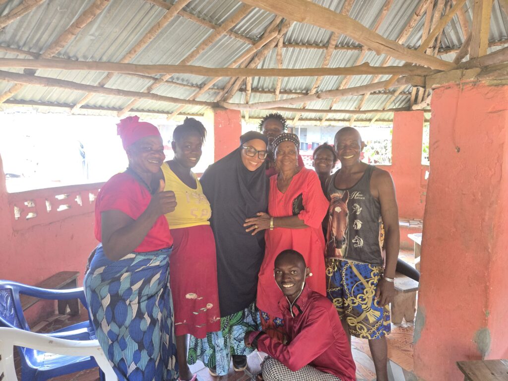 Group of people welcoming a new family to African Temne Village
